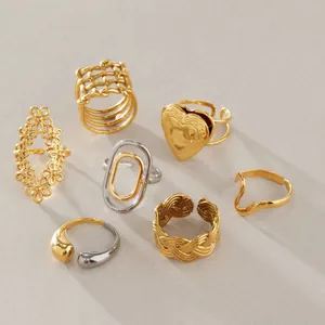 A detailed variety of minimalist stainless steel rings featuring gold and silver finishes.