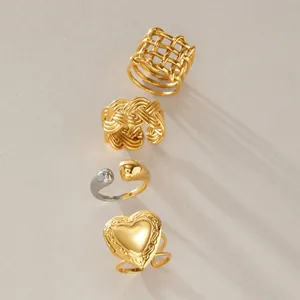 Macro shot showcasing four niche stainless steel rings with premium 18k gold plating.