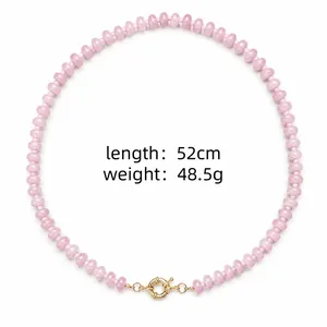Detailed view of pink natural stone beaded necklace with 52cm length and gold clasp