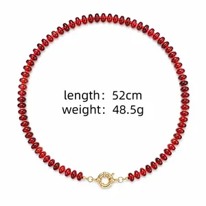 Close-up of red stone beaded necklace showing length 52cm and weight 48.5g specs