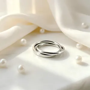 Close-up of interlocking stainless steel bands with a high-polish silver finish