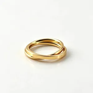Macro view of two interlocking gold stainless steel bands for a minimalist ring look.