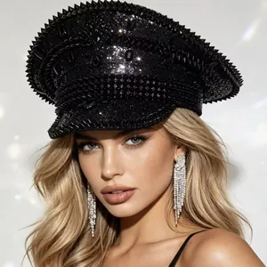 Detailed view of a black studded punk style captain hat with sparkling sequins and gemstones