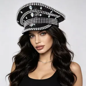 Professional model wearing a punk style rhinestone studded black navy captain hat