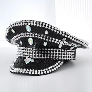 Macro detail of punk style black captain hat adorned with silver spikes and rhinestones