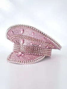 Detailed side view of pink sequin captain hat decorated with silver studs and pink gems