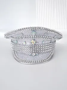Close-up of a silver punk captain hat with iridescent gems and metallic spikes.