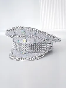 Detail of a silver punk captain hat decorated with metallic spikes and rhinestones