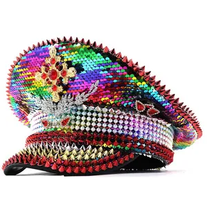 Detailed view of a rainbow sequin punk captain hat with red spikes and ornate gold cross