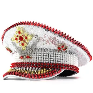 Detailed view of a punk style white navy hat with red spikes and sparkling sequins