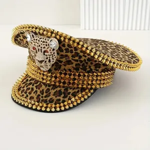 Detailed view of punk Y2K navy hat with leopard print and gold spikes.