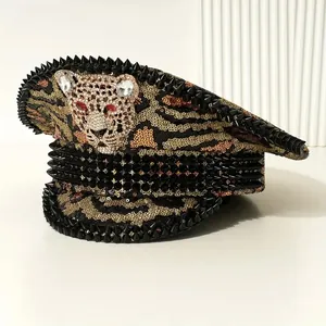 Detailed view of a sequined punk captain hat featuring black spikes and a rhinestone leopard.