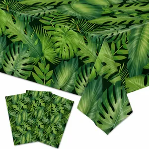 Detailed view of tropical green leaf pattern on PE plastic tablecloth and napkins.