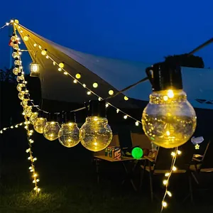 Warm G50 LED globe string lights creating cozy camping atmosphere on outdoor tent