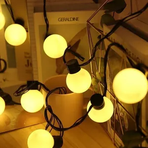Warm white G50 LED globe string lights for cozy indoor or outdoor camping decor.