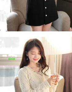 Detail view of a black mini skirt with pearl buttons and a woman in a white knitted cardigan