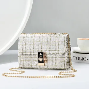 Elegant white tweed flap bag with a golden chain strap for women in a chic style