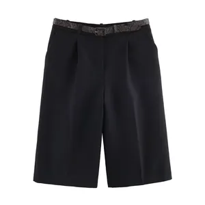 Close-up of black women's casual bermuda shorts featuring a snakeskin pattern belt