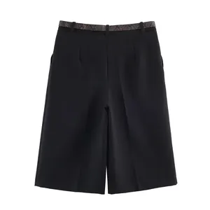 Elegant black high-waisted wide-leg shorts featuring a stylish snakeskin belt detail