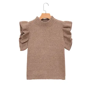 Detailed view of the layered ruffle shoulder accents on this brown knitted top.