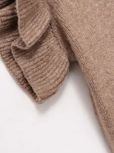 Close-up of the soft knitted texture and layered ruffle detail on this brown vest