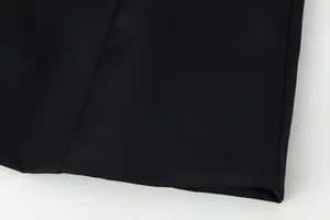 Detailed close-up view of high-quality black solid color jacket fabric and hem stitching