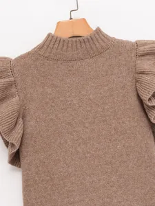 Detailed view of a fashionable brown knit vest featuring layered ruffle shoulders