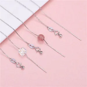 Close-up of S925 sterling silver earring thread chains with crystal bead accents.