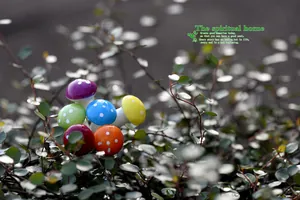 Miniature colorful mushrooms with white dots placed among green garden leaves