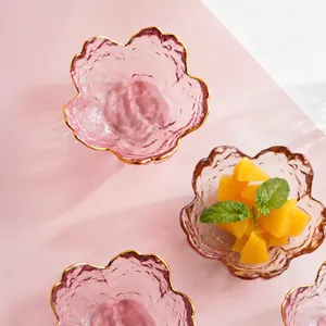 Elegant pink cherry blossom glass sauce dish with gold rim and hammered texture.