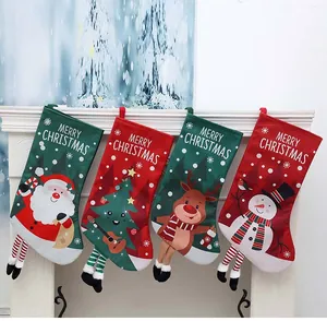 Set of four Christmas stockings with Santa, tree, reindeer, and snowman designs