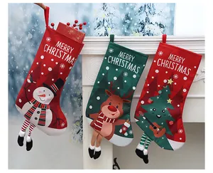 Set of three festive Christmas stockings with snowman, reindeer and tree designs