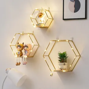 Creative mensole esagonali galleggianti in oro con base in legno per pareti