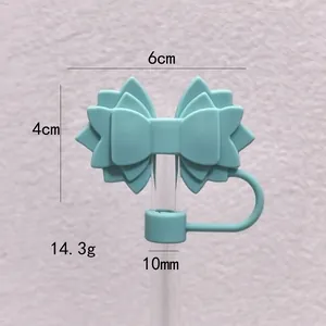 Detailed view of mint green silicone bow straw cover showing dimensions and weight