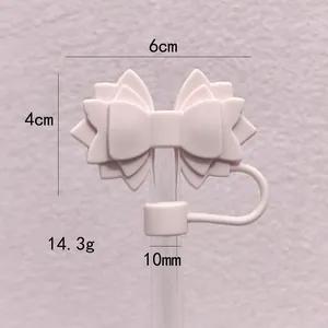 Pink silicone bow straw cover for Stanley cup with 10mm size dimensions.