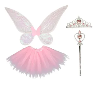 Detail view of pink iridescent fairy wings, tutu skirt, magic wand, and tiara for girls' parties