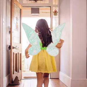 Back view of a child wearing shimmering green fairy wings walking towards a bright door