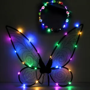 Detailed shot of glowing black fairy wings and flower headband with colorful LED lights
