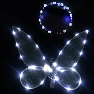 Detailed view of glowing white LED butterfly wings and matching flower crown for girls