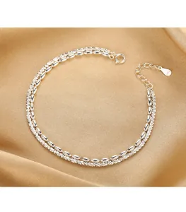 Elegant S925 silver double-layer bracelet featuring rice beads and a textured chain detail