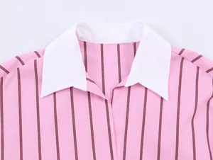 Detailed close-up of a stylish pink striped shirt with a classic white collar finish