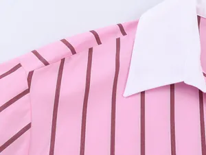 Close-up of pink striped shirt with white collar showing fabric detail and stitching