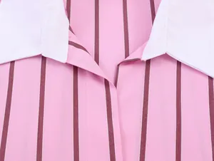 Close-up of elegant pink and burgundy striped shirt featuring a sharp white collar detail