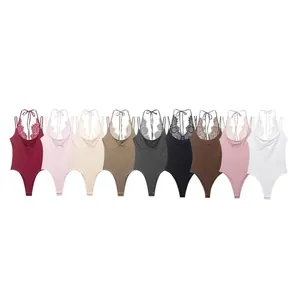 Detailed view of nine colorful lace patchwork halter neck bodysuits in a row.