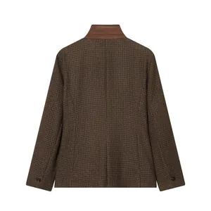 Detailed back view of a brown houndstooth plaid blazer featuring a contrast stand collar