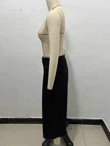 Detailed side profile of black high-waist pants featuring a stylish gold buckle on a mannequin