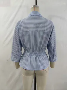 Back view of a blue and white striped blouse featuring a stylish elastic waist detail