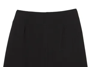 Close-up of black high-waisted barrel pants showing waist dart tailoring details