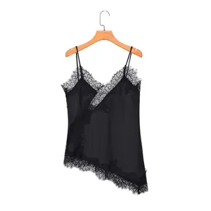 Detail showing delicate lace trim and satin fabric of the black camisole