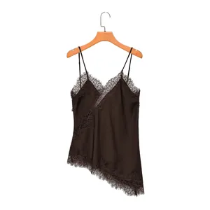 Detail of chocolate brown satin camisole with delicate lace trim and asymmetrical hem